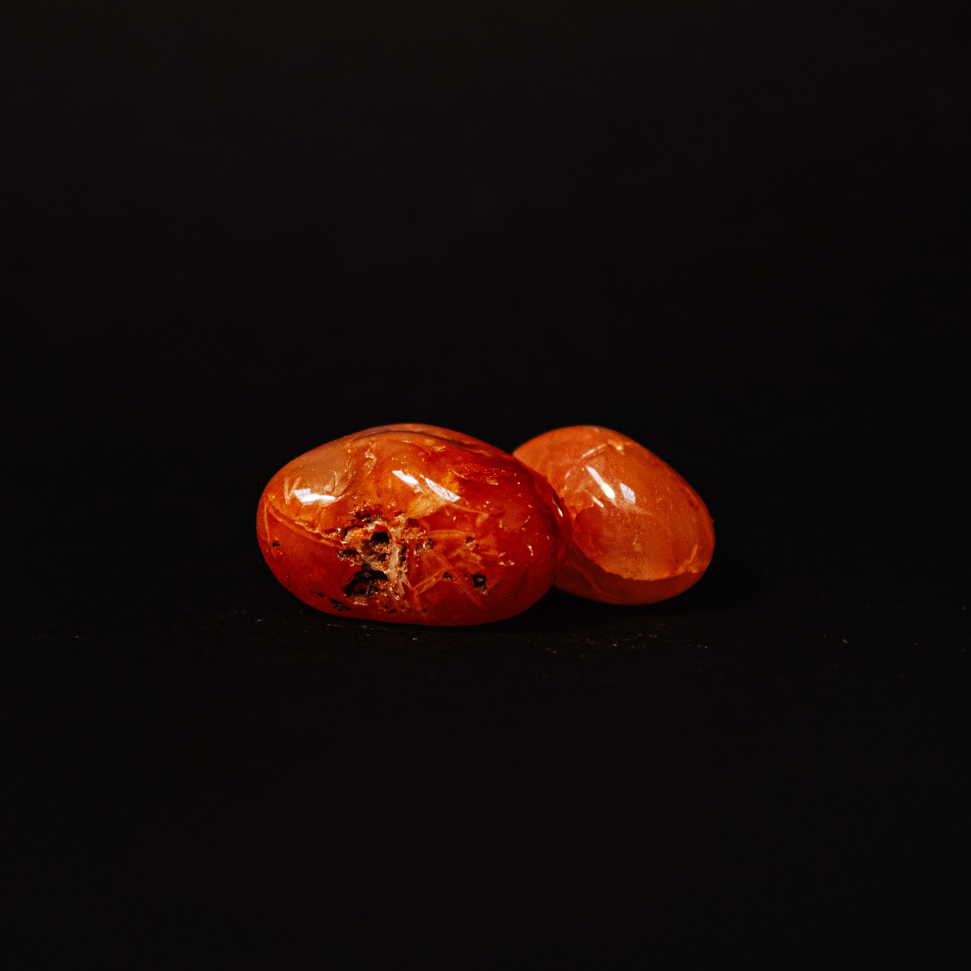 two small red-orange carnealian stones stacked