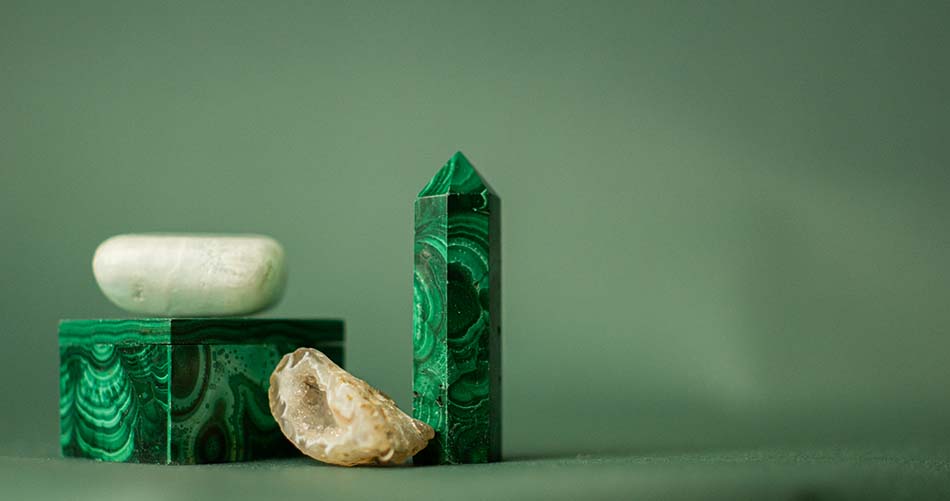 Malachine tower stone and box on a green table cloth