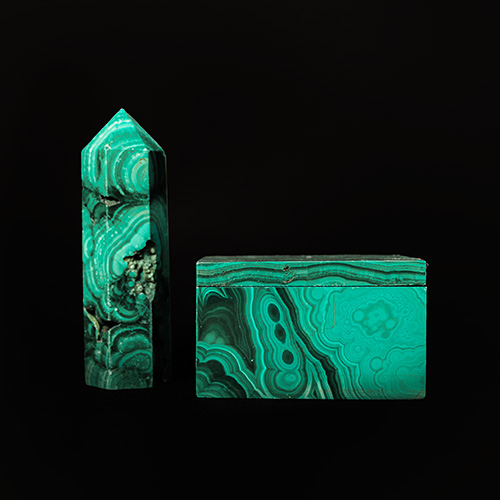 Two green gemstones with lighter green ring pattern