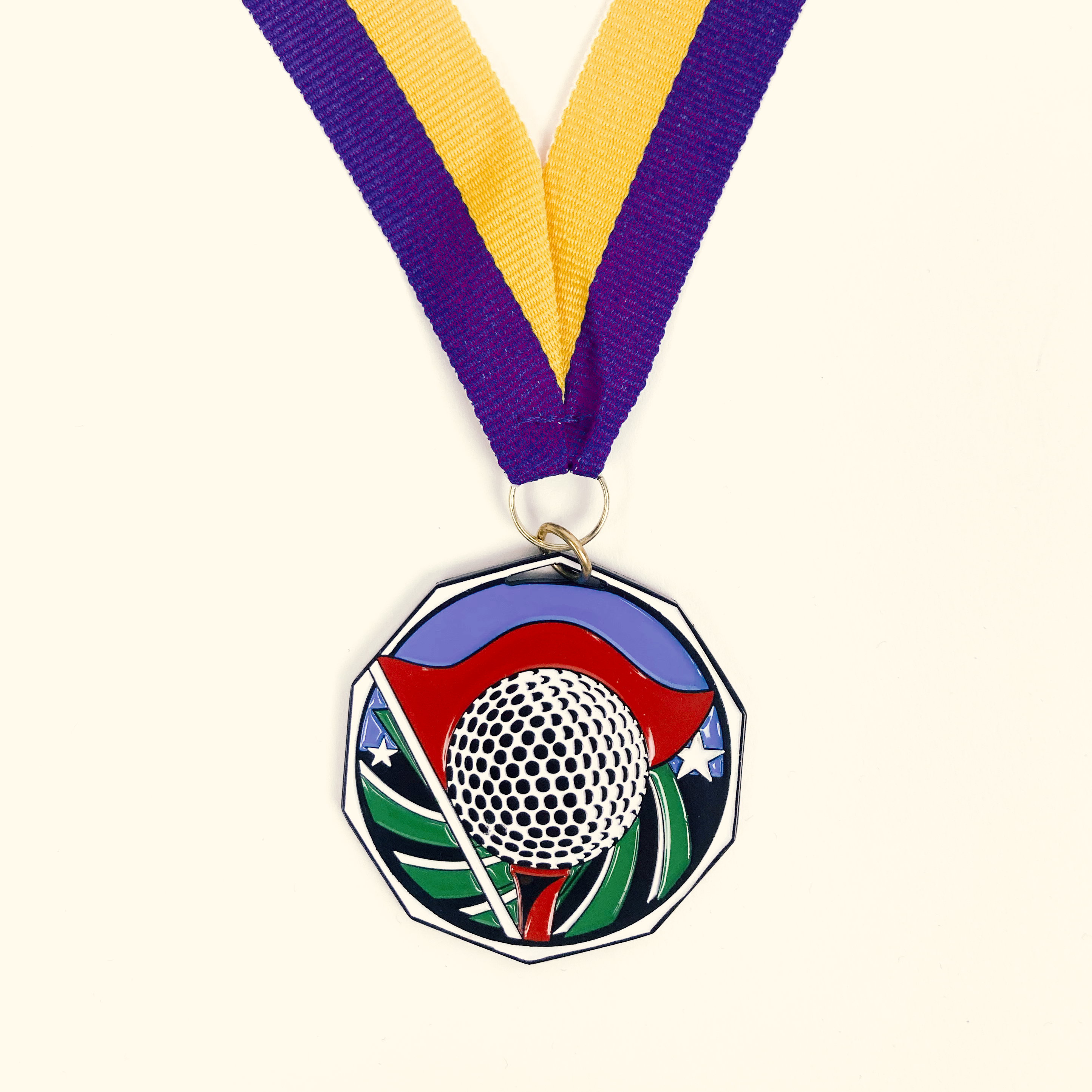 medal with golf ball on it