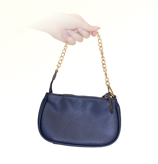 Hand holding to show Carlee's back view, plain blue shiny pleather