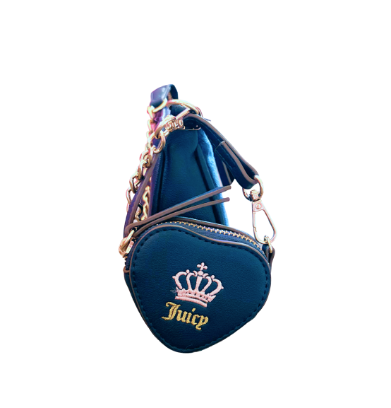 A side view of Carlee, blue heart-shaped mini wallet with a crown and Juicy embroidered in gold. It hangs from a chain strap.