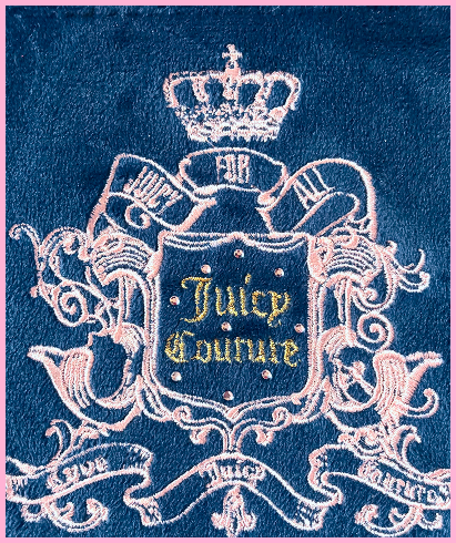 A detail shot of Carlee featuring pink embroidery and pink jewels around the words Juicy Couture