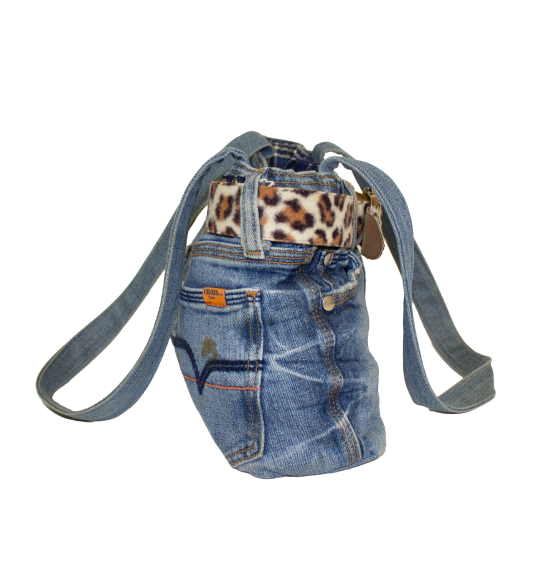 Side view of Jenine that show long denim straps and slouched over profile.
