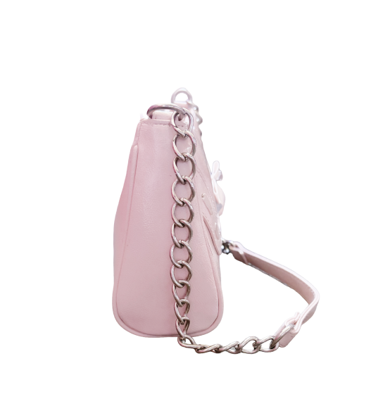 Side view of shiny pink clutch purse with a silver chain strap showing flat profile.