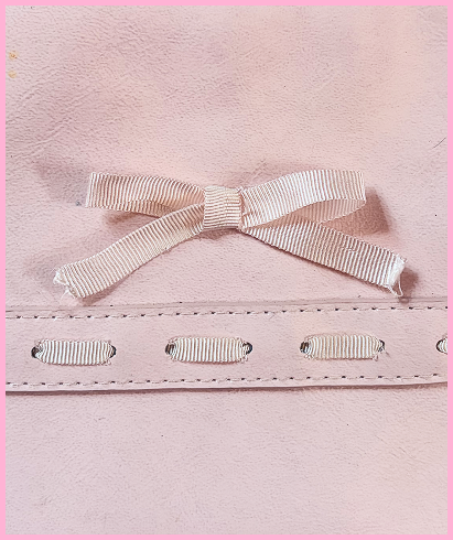 Detail shot of Whitney's laced bow detail.