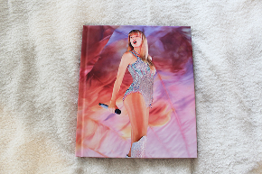 Front cover of official Eras Tour book.