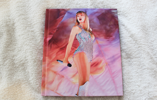 Front cover of official Eras Tour book.