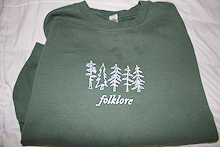 Dark green sweatshirt that reads Folklore.