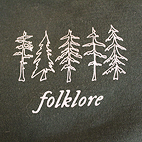 Dark green sweatshirt that reads Folklore.