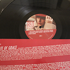 Vinyl cover that showcases the songs on specific vinyl with a black vinyl.