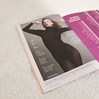 Angled view of a spread featured in Time Magazine that shows photo of Taylor Swift.