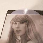 Vinyl cover that shows a photo of Taylor Swift on specific vinyl with a transparent white vinyl.