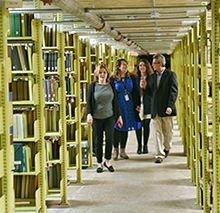 People walking through the archives library.